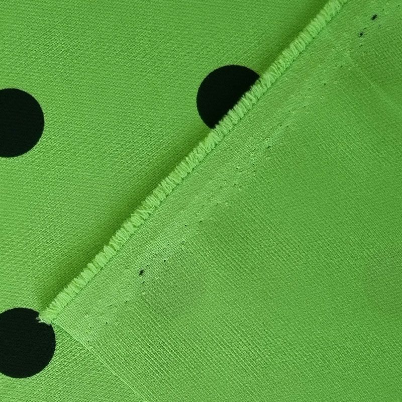 Tela Bielástica Verde Pistacho con Lunares Negros de 2cm (ancho 1,50M) - Imagen 3